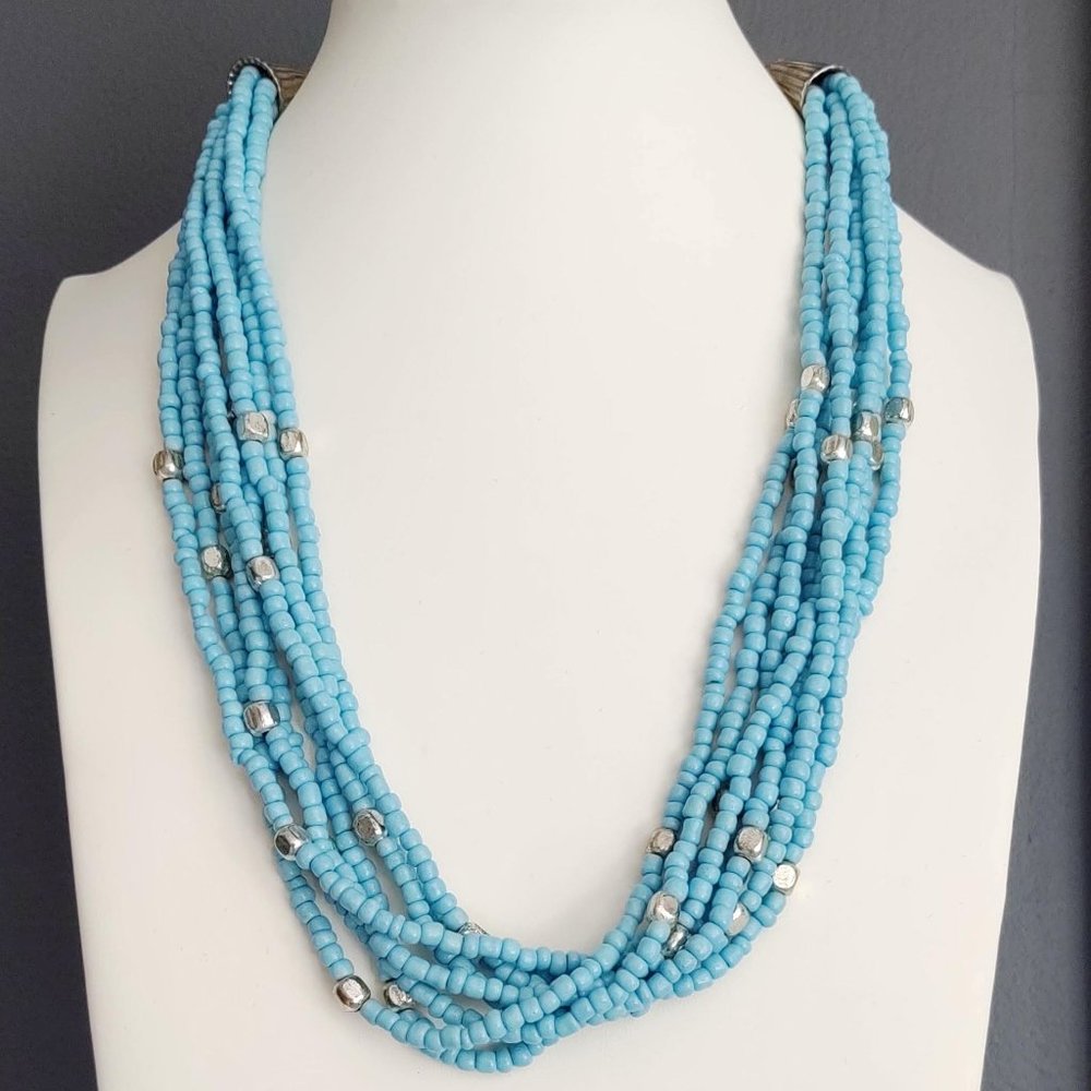 8 strand blue and silver beaded necklace